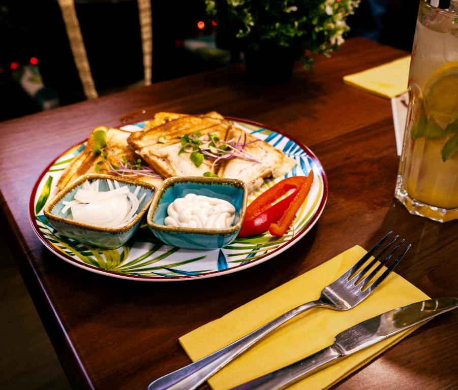 a plate of food on a table with a plate of food at easyHotel Budapest Oktogon in Budapest