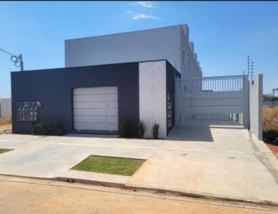 a large building with a garage at top residencial 2 in Sinop