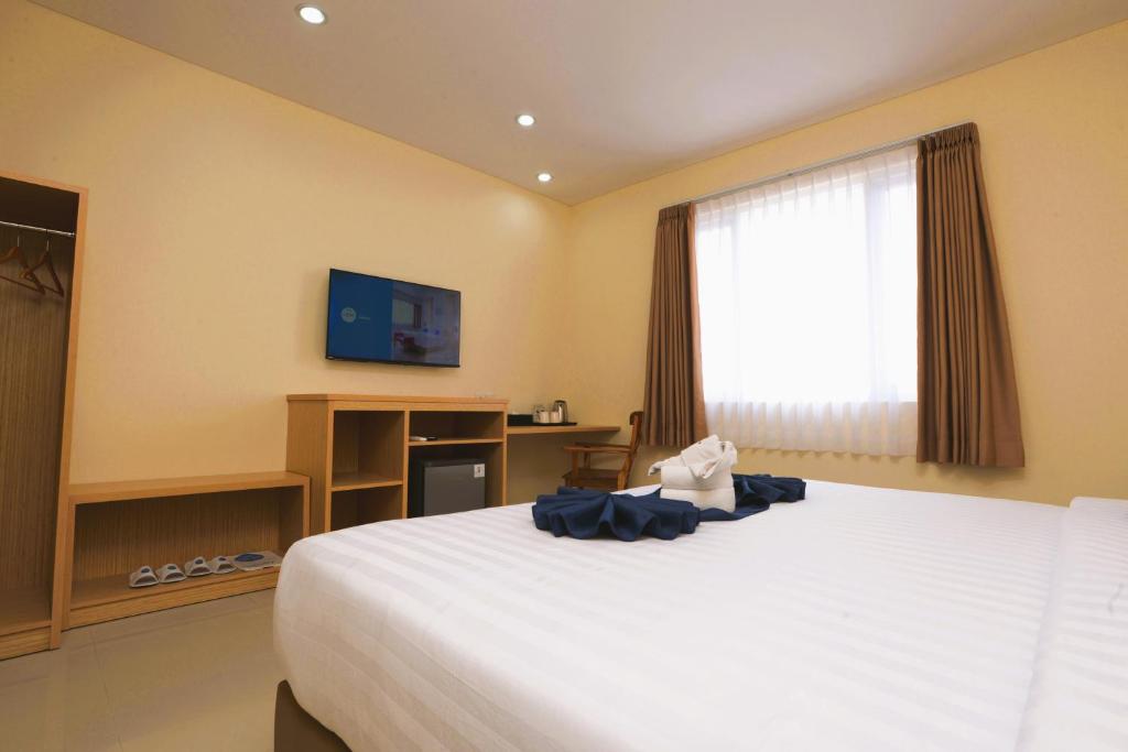 Postel nebo postele na pokoji v ubytování Hotel Dafam Rio
