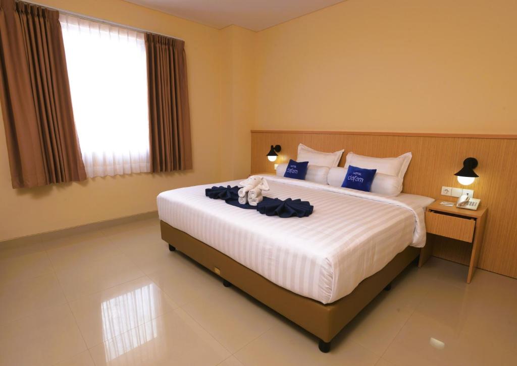 Postel nebo postele na pokoji v ubytování Hotel Dafam Rio