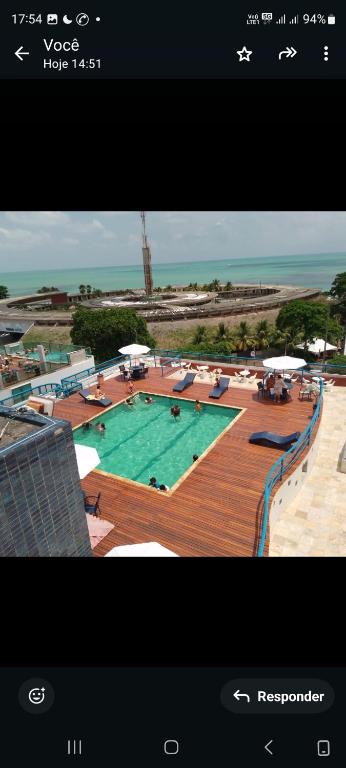 a picture of a large swimming pool with at Victory Flat&Hotel in João Pessoa