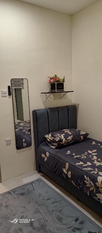 Ένα ή περισσότερα κρεβάτια σε δωμάτιο στο Homestay Iman Seri Iskandar Uitm Perak Utp