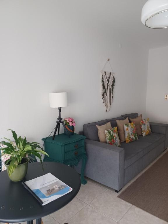 a living room with a couch and a table at Wave Beach House in Vila do Conde