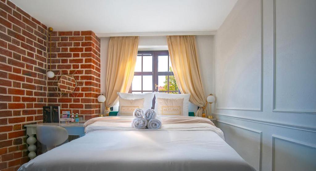 Ένα ή περισσότερα κρεβάτια σε δωμάτιο στο Motlawa Apartments Gdansk Old Town