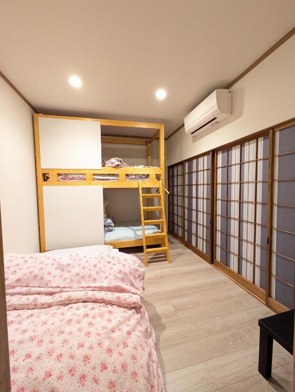 Postel nebo postele na pokoji v ubytování お宿みとしる