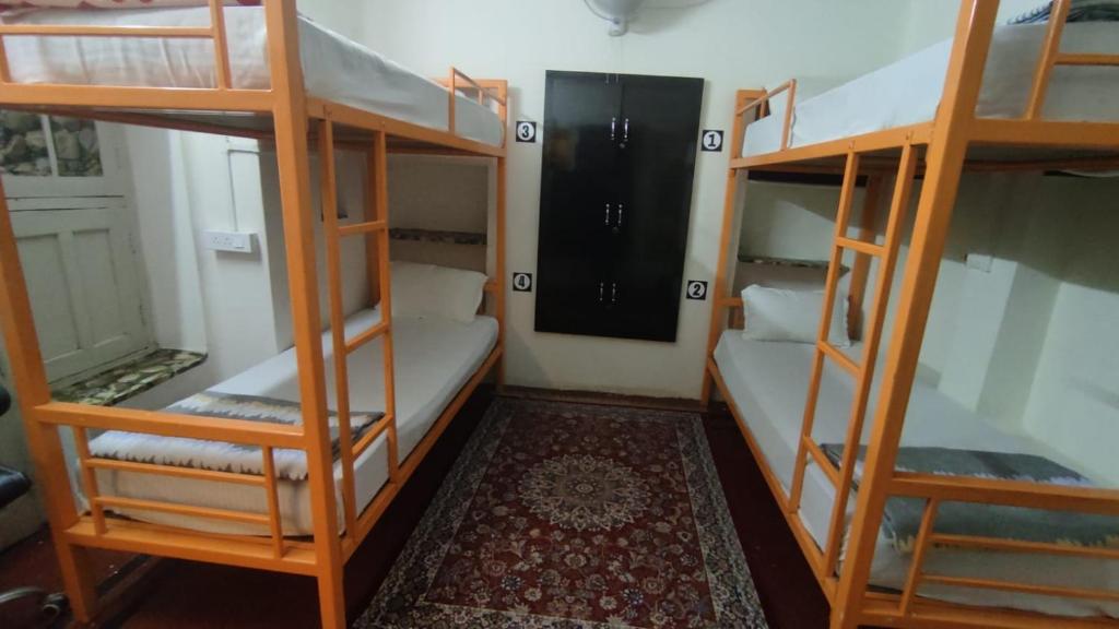 Voodi või voodid majutusasutuse Inka Kashi Hostel toas
