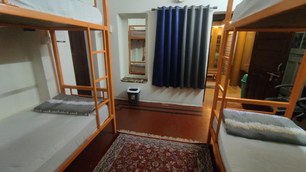 Voodi või voodid majutusasutuse Inka Kashi Hostel toas