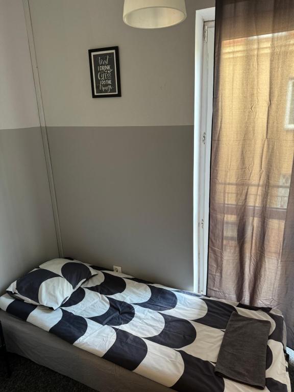 Posteľ alebo postele v izbe v ubytovaní Wilanowska Hostel