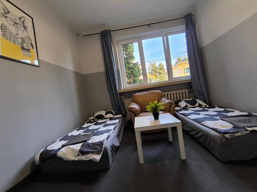 Posteľ alebo postele v izbe v ubytovaní Wilanowska Hostel