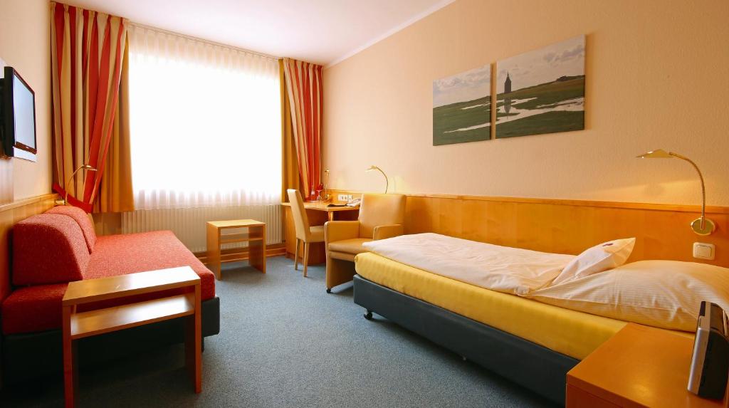 Postel nebo postele na pokoji v ubytování Hotel Hanken GmbH, Hotel Hanken und Seehotel