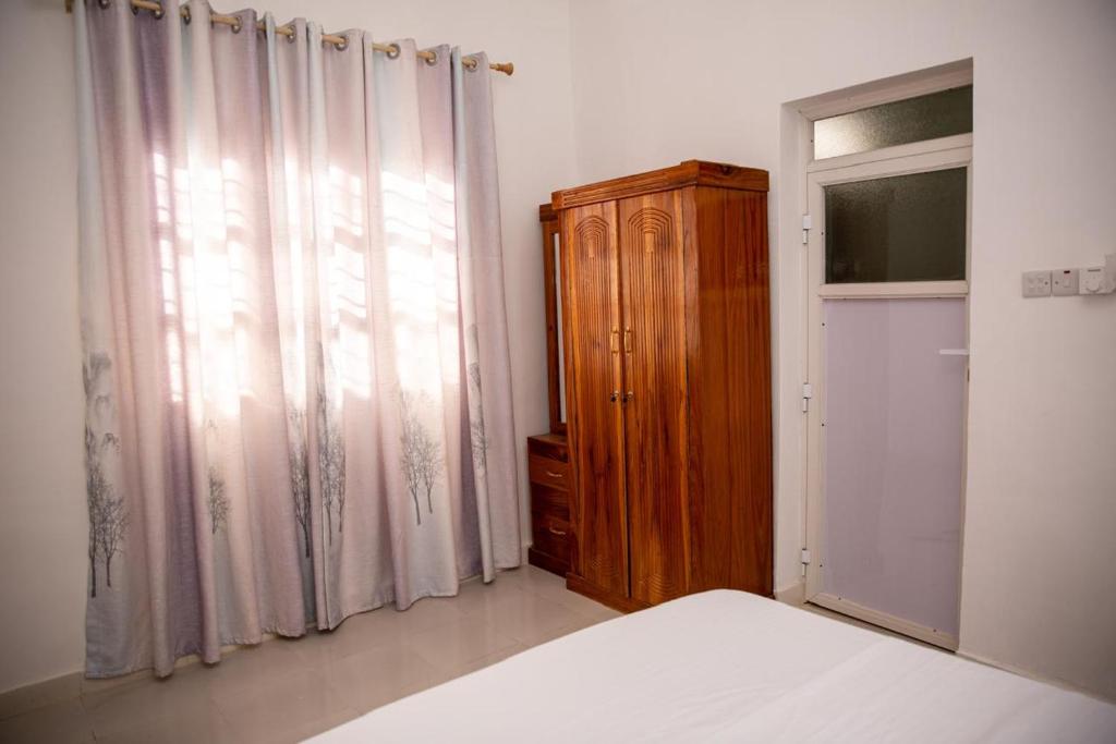Postel nebo postele na pokoji v ubytování KKJ House
