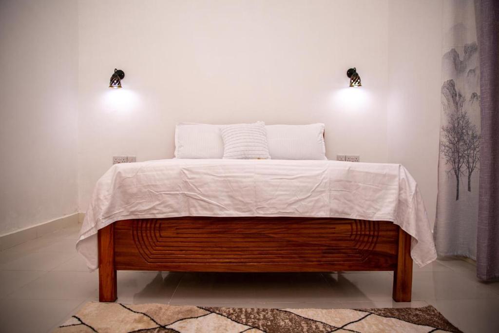Postel nebo postele na pokoji v ubytování KKJ House