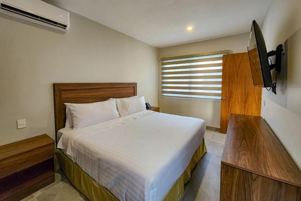 Postel nebo postele na pokoji v ubytování Memora Hotel & Villas Chapala