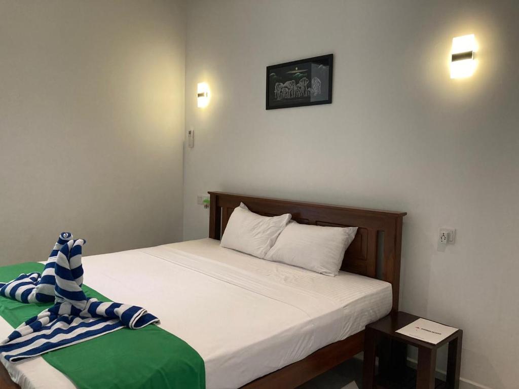 Postel nebo postele na pokoji v ubytování Kirinda Paradise Yala