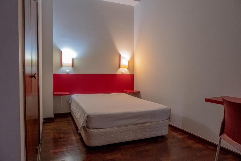 Postel nebo postele na pokoji v ubytování Residencial Chafariz /Queimada