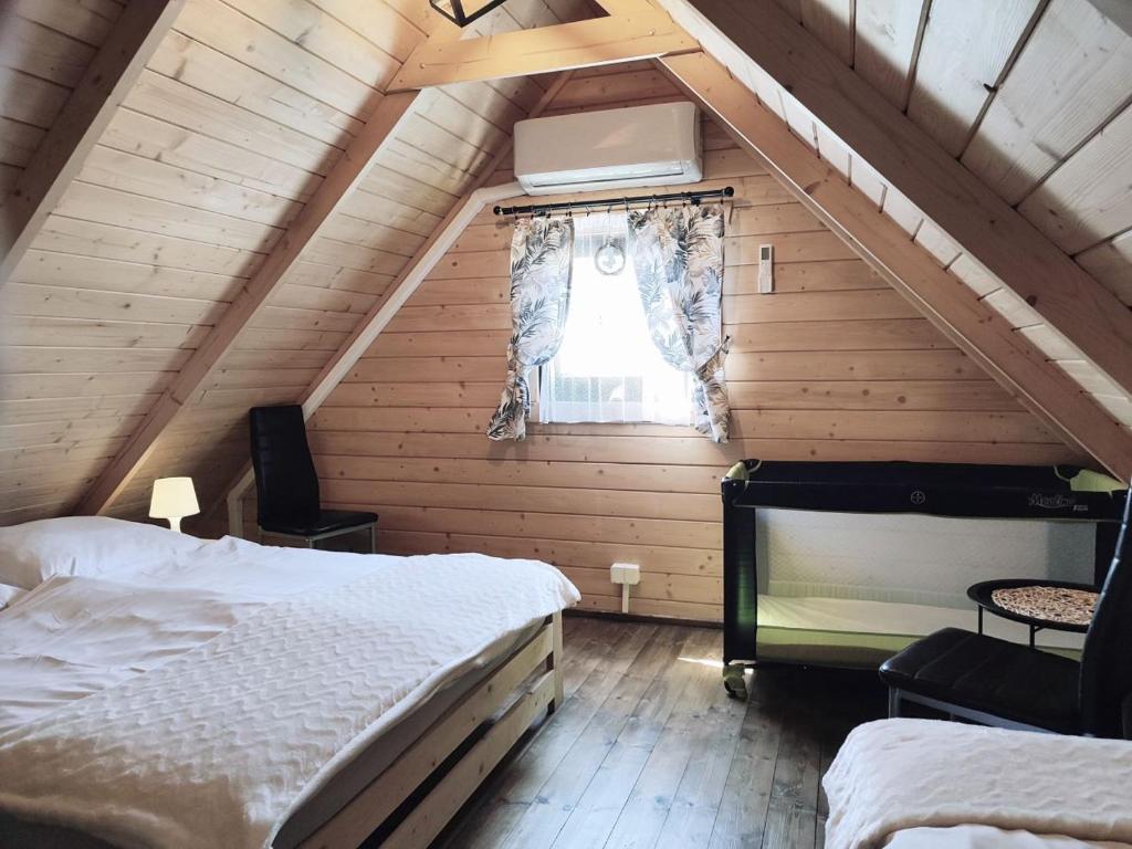 Posteľ alebo postele v izbe v ubytovaní Osada Widok na Góry - Dwa domki z Jacuzzi na wyłączność
