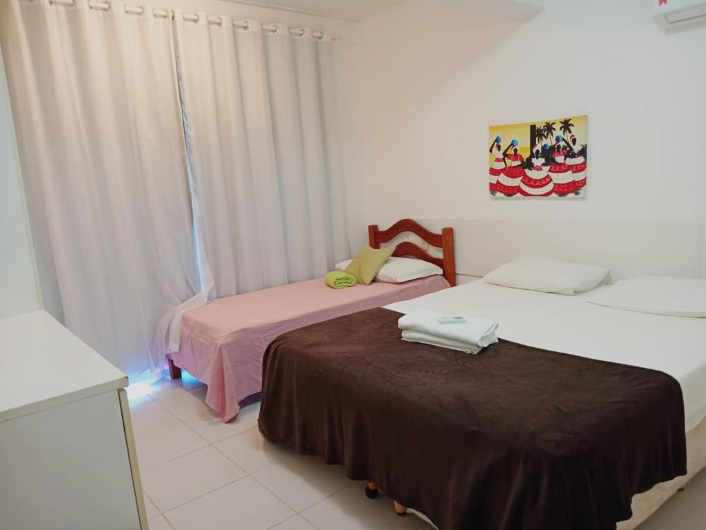 Postel nebo postele na pokoji v ubytování Apartamento Térreo 3 suítes Master Resort Treebies à Beira Mar Subauma Bahia