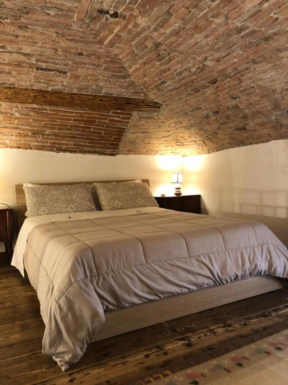 A bed or beds in a room at Casa Vacanze Piazza Vecchia