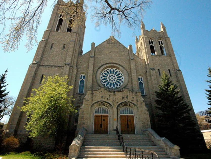 a large church with stairs in front of it at Merj's Guest House in Wolesly in Winnipeg