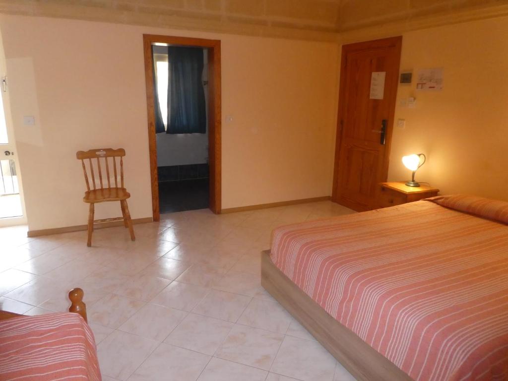 Postel nebo postele na pokoji v ubytování San Antonio Guesthouse