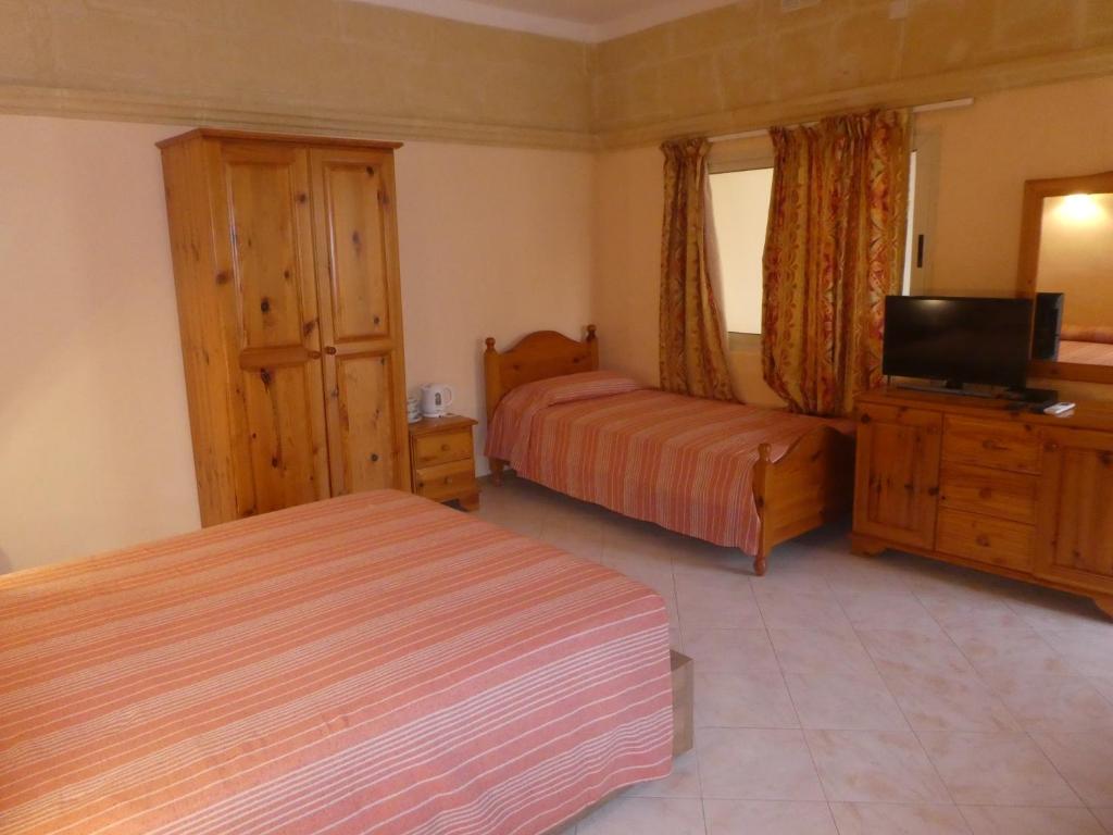 Postel nebo postele na pokoji v ubytování San Antonio Guesthouse