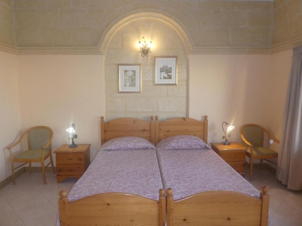 Postel nebo postele na pokoji v ubytování San Antonio Guesthouse