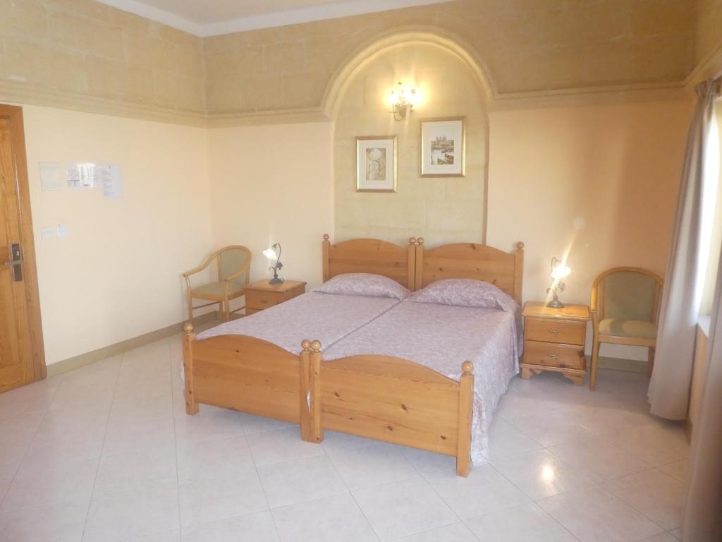 Postel nebo postele na pokoji v ubytování San Antonio Guesthouse