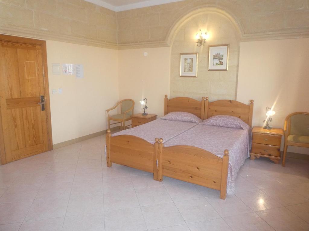 Postel nebo postele na pokoji v ubytování San Antonio Guesthouse