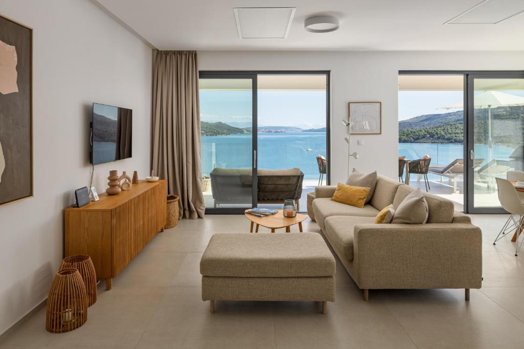 Image showcasing Refined Design with Coastal Views at Marina Collection Penthouse