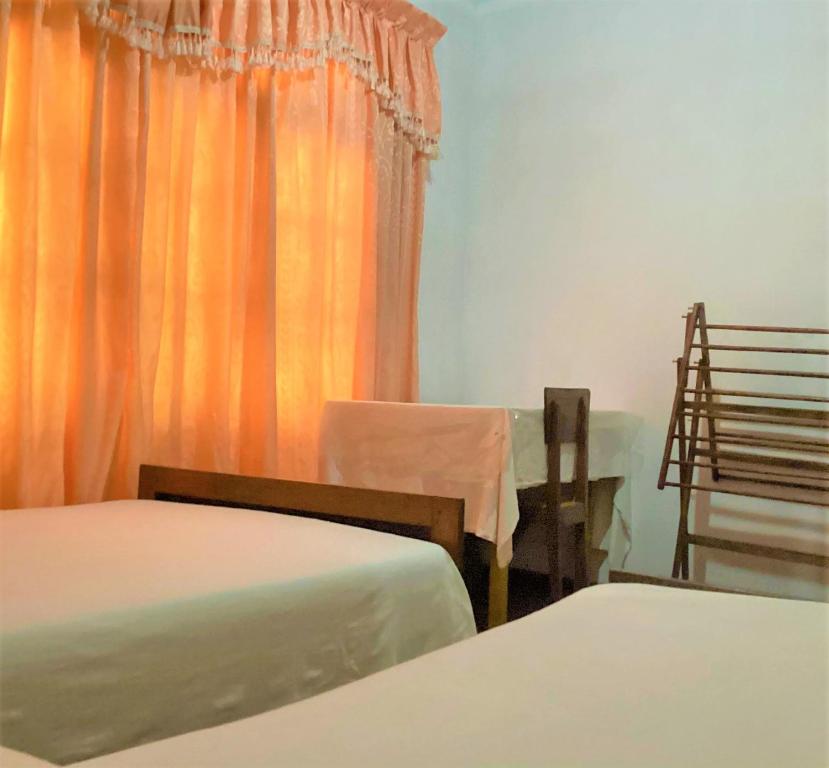 Postel nebo postele na pokoji v ubytování Grand Refuge Holiday Rooms