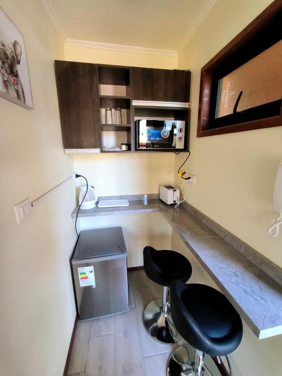 TV a/nebo společenská místnost v ubytování APART HOTEL EN BULNES