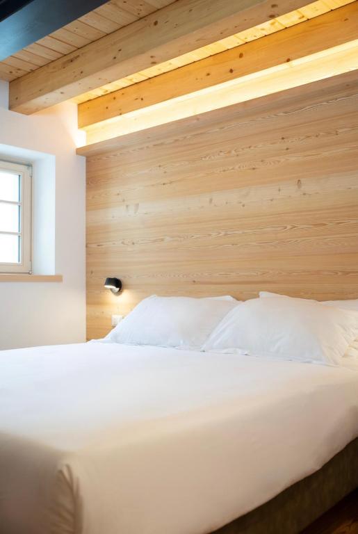 Postel nebo postele na pokoji v ubytování Chalet Le Grazie
