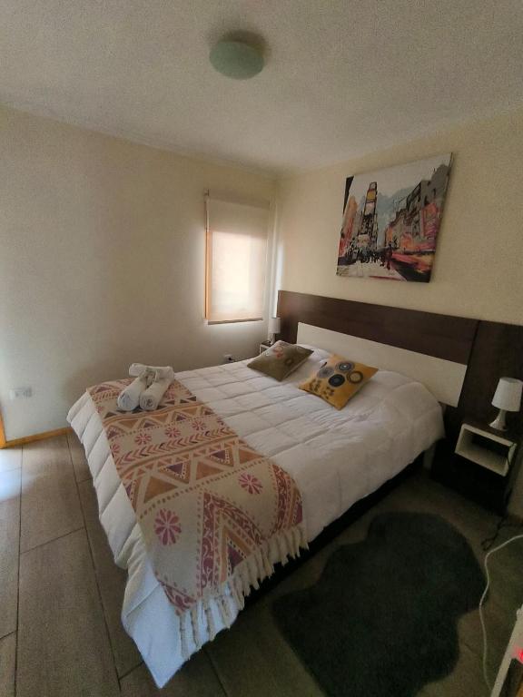 Postel nebo postele na pokoji v ubytování APART HOTEL EN BULNES