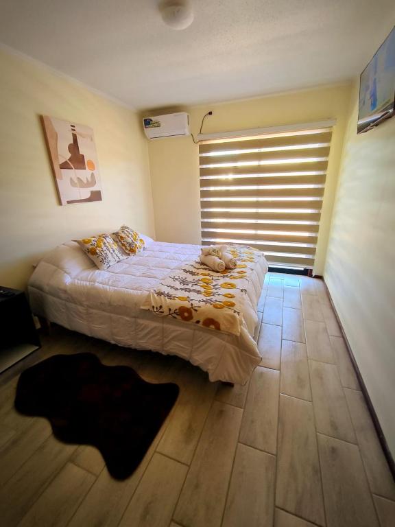 Postel nebo postele na pokoji v ubytování APART HOTEL EN BULNES