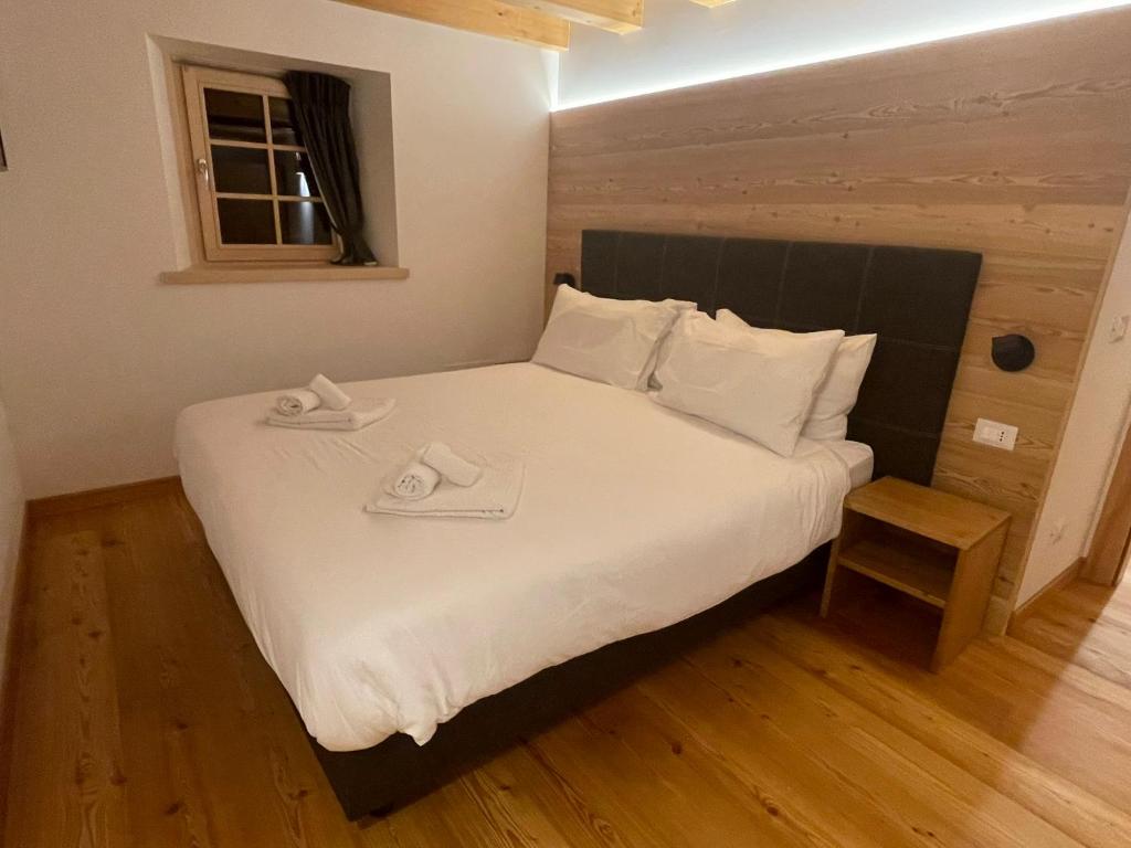 Postel nebo postele na pokoji v ubytování Chalet Le Grazie