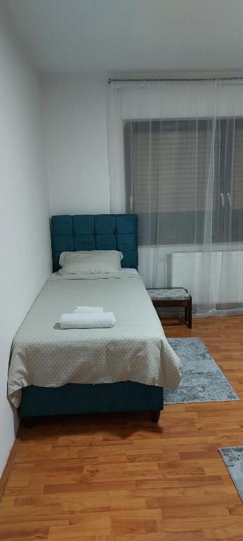 Postel nebo postele na pokoji v ubytování Apartman Aleksic