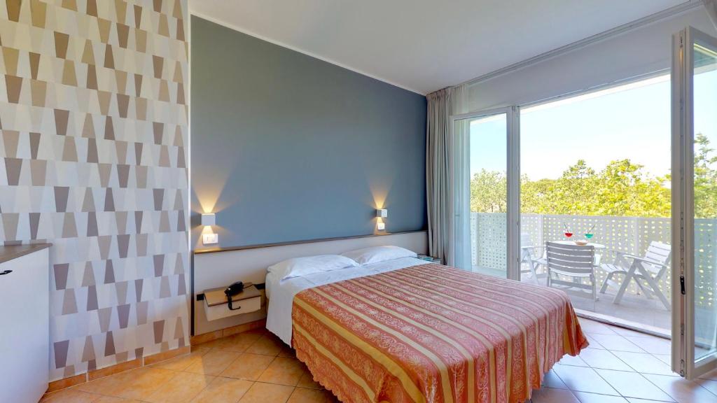 Posteľ alebo postele v izbe v ubytovaní Hotel Excelsior