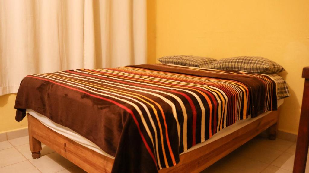 Postel nebo postele na pokoji v ubytování Posada La Mora - Hospedaje Panoramico