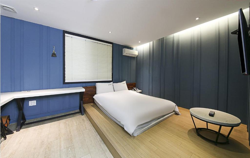Postel nebo postele na pokoji v ubytování Ignis Hotel