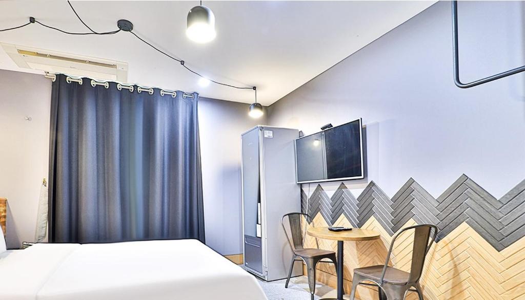 Postel nebo postele na pokoji v ubytování Ignis Hotel