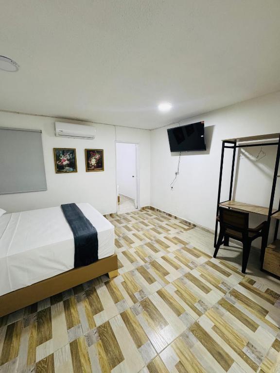 Postel nebo postele na pokoji v ubytování Hotel Estadio 80