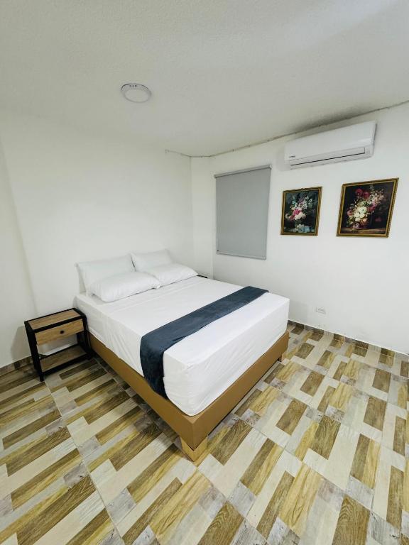 Postel nebo postele na pokoji v ubytování Hotel Estadio 80