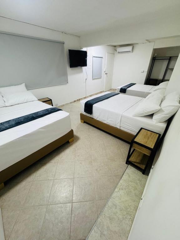 Postel nebo postele na pokoji v ubytování Hotel Estadio 80