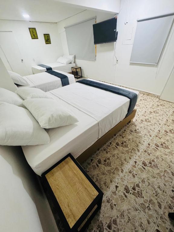 Postel nebo postele na pokoji v ubytování Hotel Estadio 80