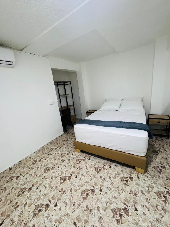 Postel nebo postele na pokoji v ubytování Hotel Estadio 80