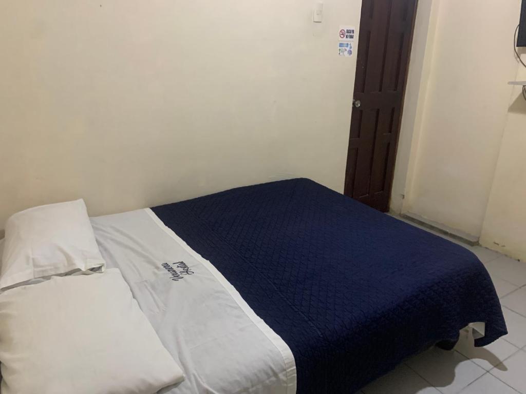 Postel nebo postele na pokoji v ubytování Veranera Hostal