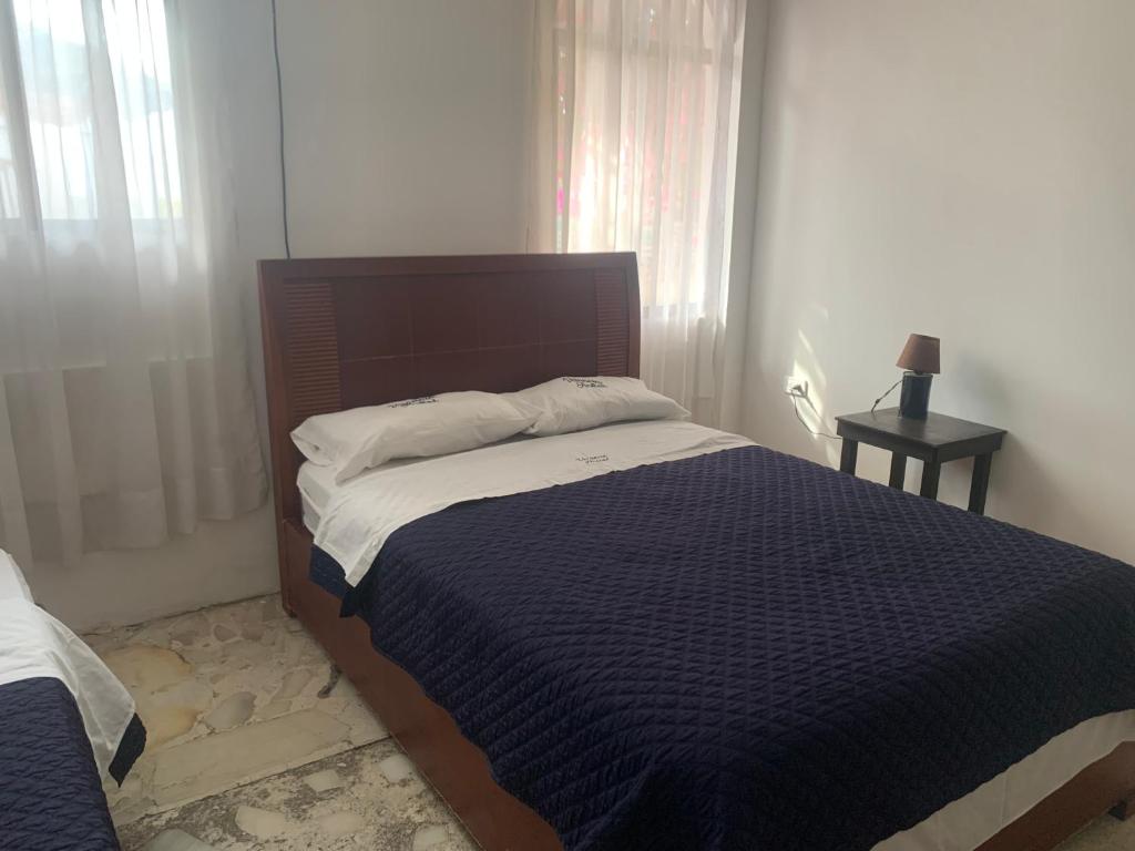 Postel nebo postele na pokoji v ubytování Veranera Hostal
