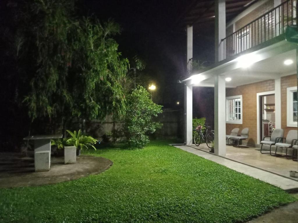a yard of a house at night at Villa Shendel in Gampaha