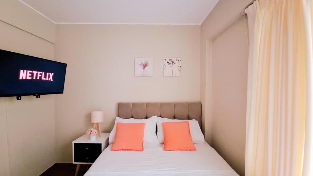 Postel nebo postele na pokoji v ubytování Miraflores Habitacion con baño compartido