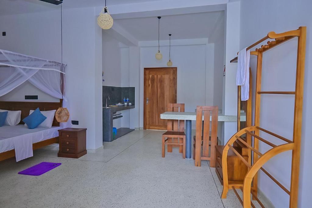 Postel nebo postele na pokoji v ubytování SPRING VILLA AHANGAMA